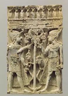 Wear Prints: Furniture plaque carved in high relief with two Egyptianizing figures flanking a volute tree ca