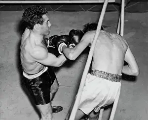 Spotlight Prints: G. Zuddas has K. James ***** rope. September 09, 1954