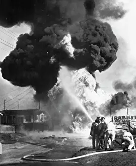 Bomb Prints: Gas Explosion Injures Five -- Firemen battle flames after gasoline from a broken line exploded at nearby Lawndale today