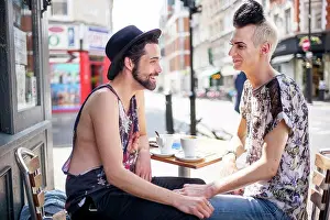 Adult Sonly Prints: A gay couple chat outside a coffee shop in London