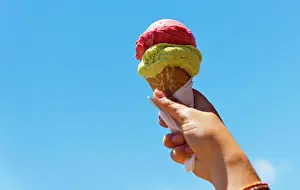 Freude Prints: Gelati Ice Cream Cone Gelati ice cream cone held up to the hot summer sky