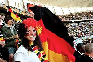 Republic Of South Africa Prints: German football supporter with the German national flag in the stadium
