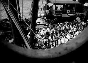 Uniform Prints: German internees coming aboard the Queen Mary at Singapore
