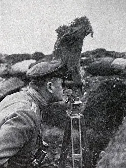 Trench Prints: German soldier looks over a trench using a periscope in World War One 1915