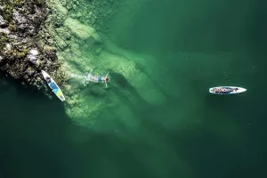 Drift Prints: Germany, Bavaria, Aerial view of two¶ÿpaddleboarders¶ÿrelaxing on green shore of Lake¶ÿWalchen