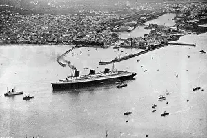 Sunk Prints: Giant Liner Leaves Port -- An aerial view of the giant giant liner Normandie as she left St