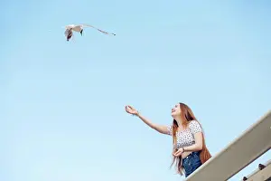 Apparel Prints: Ginger teen girl feeding seagulls