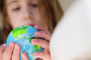 Globe Prints: Girl (6-7) holding globe