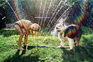 Gradeschooler Prints: girl and dog drinking at the hose during a hot summer evening