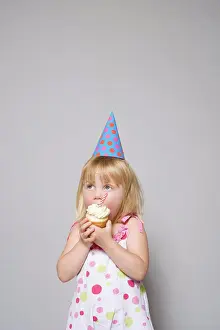 Icing Prints: Girl eating a cupcake