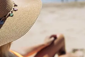 Bikini Prints: girl in a hat, a close-up on the tanned and slender legs of a girl