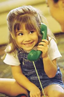 4 5 Years Prints: Girl holding a telephone receiver smiling