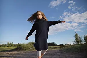 Runner Prints: A girl with long hair is spinning close-up