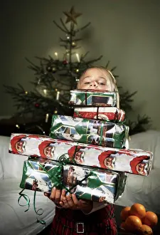 Holidays Prints: Girl behind pile of Christmas gifts