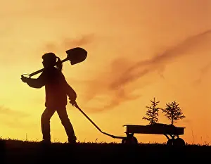 Somebody Prints: girl pulling a wagon containing trees/tree planting