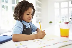 Mixed Prints: Girl In School Uniform Doing Homework In Kitchen