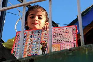 Human Presence Prints: Girl and script latin alphabet Dharamsala Himalayas India