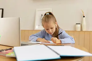 girl studying from home online