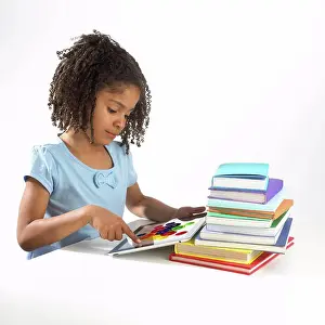 6 7 Years Prints: Girl using tablet computer