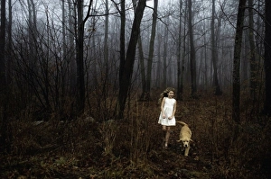 Only One Prints: Girl wearing white dress walking her dog in forest