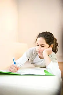 Puberty Prints: Girl writing on sheet of paper