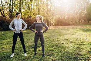 Grandma Prints: Two girlfriends are doing exercises in nature, looking at each other