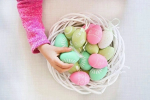 Red Letter Day Prints: Girl's hand taking coloured Easter egg