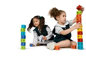 Concentrate Prints: Girls playing with plastic blocks