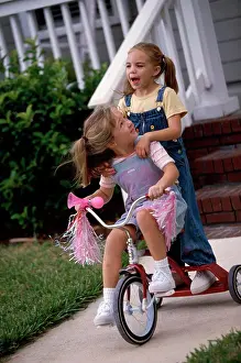 4 5 Years Prints: Two girls playing on a tricycle