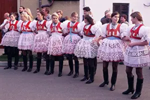 Culture Prints: Girls in traditional dress lined up during ceremony