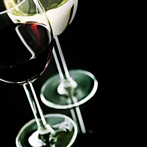 Sun Light Prints: Glasses of wine on black background