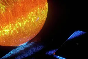 Worlds Prints: A glowing crystal sphere as orange laser light shines through