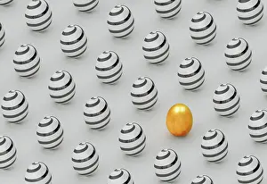 Contrast Prints: Golden egg on a background of painted eggs for Easter