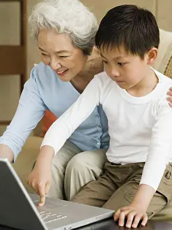 Instruction Prints: Grandmother and grandson with laptop