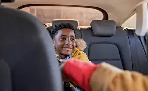 4 5 Years Prints: Grandmother reaching grandson sitting on backseat in car