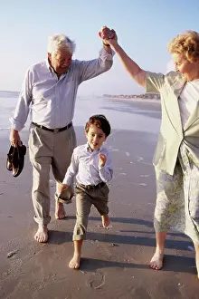 Grandfather Prints: Grandson running at the beach with his grandparents