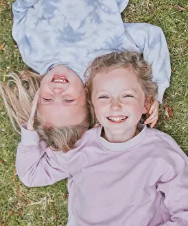 Cheerful Prints: Grass, smile and siblings in portrait with lying