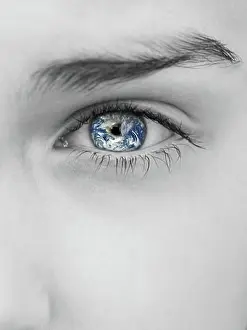 Earth Day Prints: Grayscale close-up of woman's eye with earth reflection