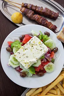 Greece, Peloponnese, Corinth, Greek Salad and Souvlaki with French Fries