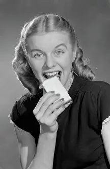 Biscuit Prints: Greedy young woman eating biscuit
