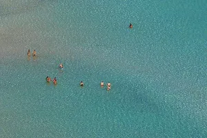 Crete Prints: Green lagoon, single people standing in shallow water
