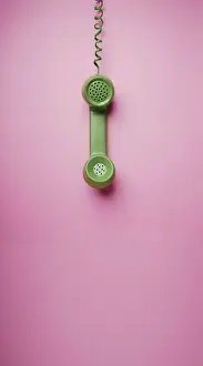 Pink Prints: Green Vintage Retro Telephone Handset Hanfing on Pink background