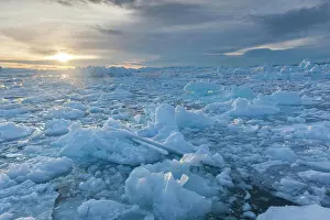 Iceberg Prints: Greenland, Disko Bay, Ilulissat, floating ice at sunset