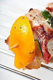 Background White Prints: Grilled shashlik on a charcoal grate over a white background