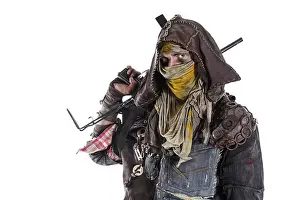 Ragged Prints: Grimy post apocalypse survivor in tatters with homemade weapons