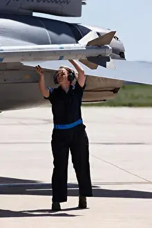 Cockpit Prints: Ground crew person arms an Aim-9 Sidewinder air-to-air heat seeking missile on an F-16 Fighting Falcon