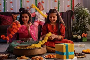 Occasion Prints: Group of children making garlands with flowers during Diwali celebration