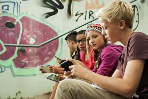 Model Release Prints: Group of children sitting on stairs outdoors