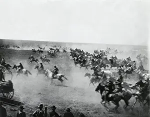 Group of cowboys riding horses, USA