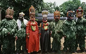 Side By Side Prints: Group of Kummatti Kali dancers standing side by side, Kerala, India